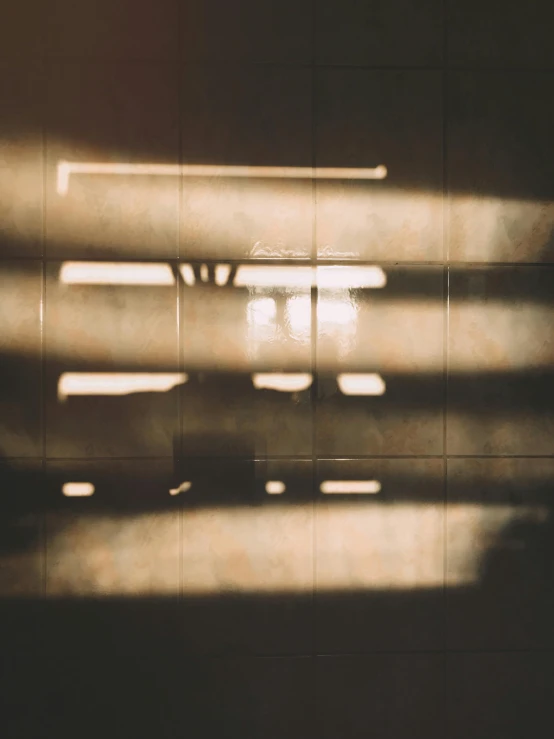 the sun shines through the blinds of a window, a picture, inspired by Elsa Bleda, ( ( strong stippled shadows ) ), trending on vsco, like a catalog photograph, light traces