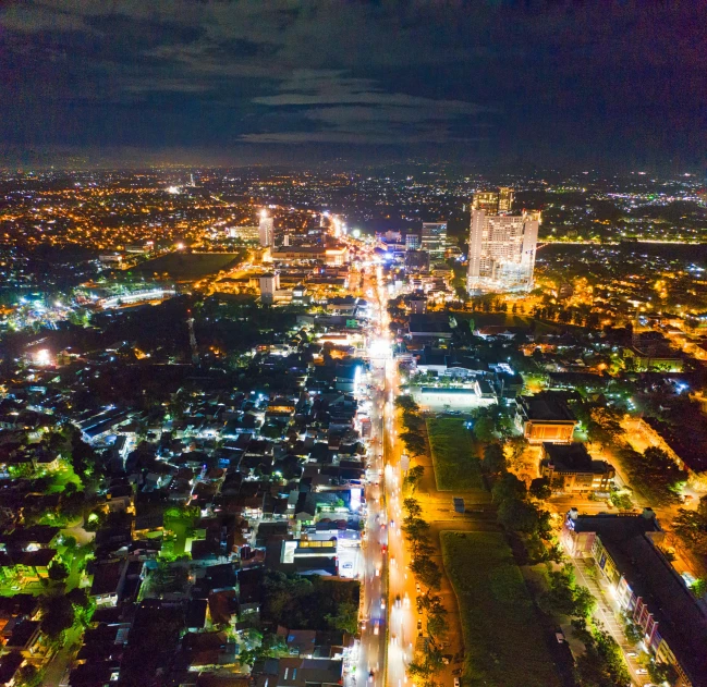 an aerial view of a city at night, pexels contest winner, futuristic phnom-penh cambodia, ultrawide lens”, colombo sri lankan city street, high resolution photo