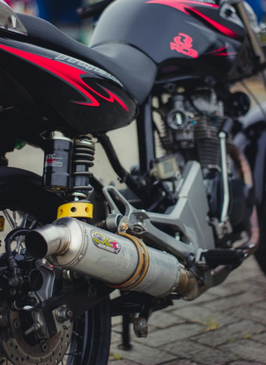 a close up of a motorcycle parked on a street, underbody, profile image, ( mechanical ), regular build