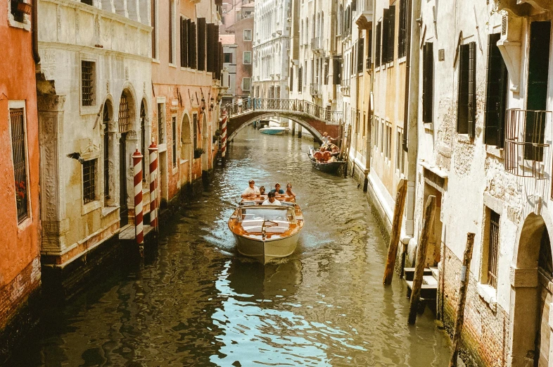 a group of people riding on top of a boat down a river, by Carey Morris, pexels contest winner, renaissance, canals, 🚿🗝📝, thumbnail, brown