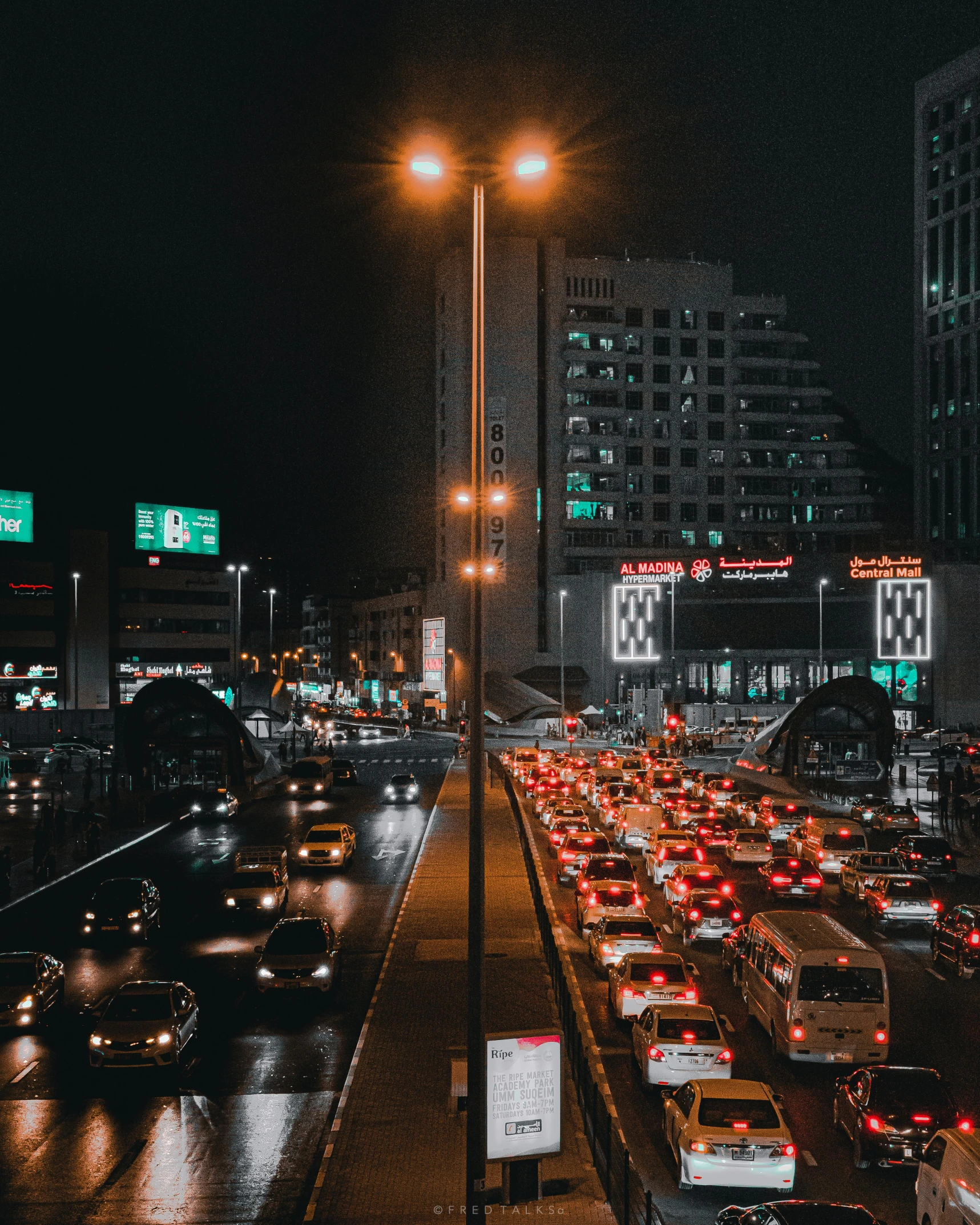 a city street filled with lots of traffic at night, trending on vsco, middle east, non-binary, snapchat photo