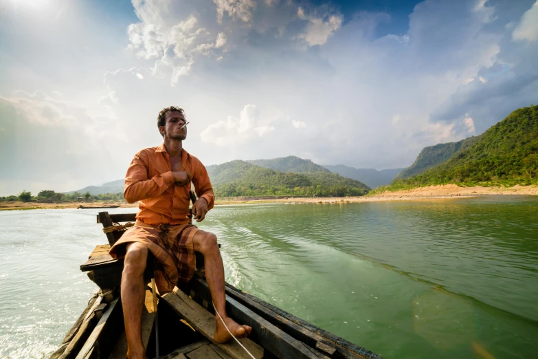 a man that is sitting on a boat in the water, inspired by Steve McCurry, pexels contest winner, sumatraism, avatar image, hugh grant man vs wild, thumbnail, drinking