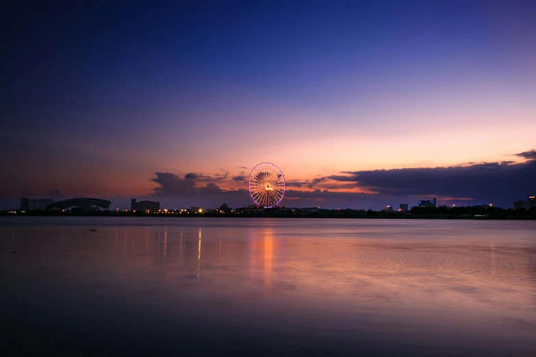 a ferris wheel sitting in the middle of a lake, pexels contest winner, hurufiyya, twilight skyline, manila, soft rim light, ultrawide lens”