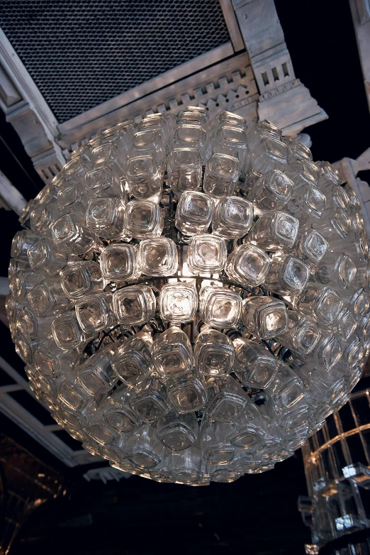 a chandelier hanging from the ceiling of a building, cast glass eyes, eero aarnio, clear detailed view, soda