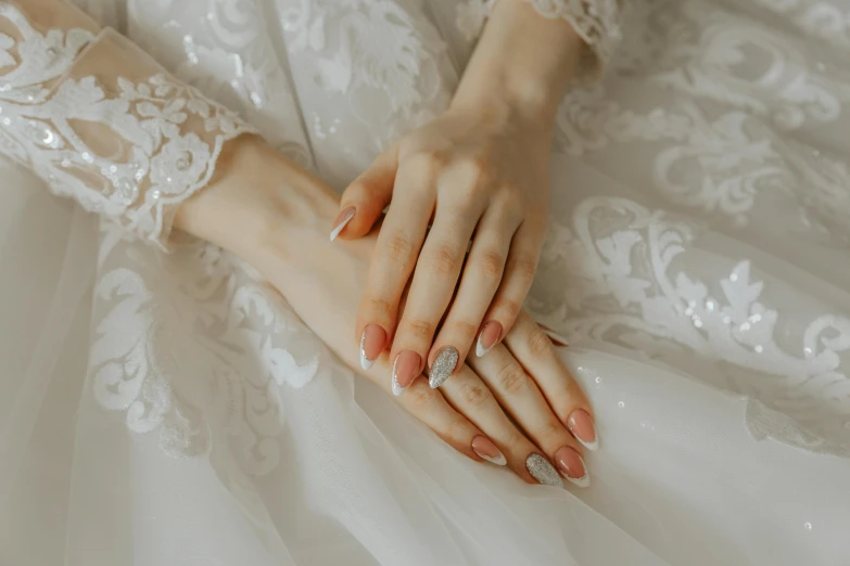 a close up of a person wearing a wedding dress, trending on pexels, long fingernails, white and orange, thumbnail, elegant lady with alabaster skin