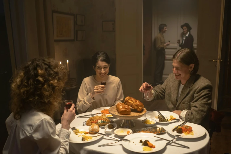 a group of people sitting around a dinner table, inspired by Peder Severin Krøyer, pexels, fantastic realism, movie still 8 k, natalia dyer, france, séance