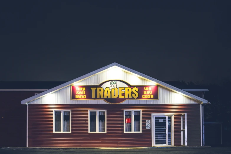 a building that is lit up at night, a stock photo, by Drew Tucker, trending on unsplash, trailer park boys, traders, exiting store, the potatoes eaters