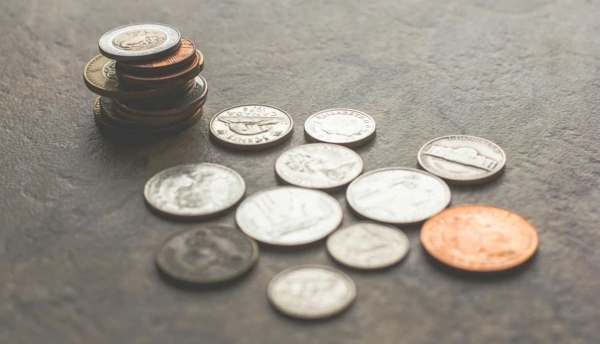 a pile of coins sitting on top of a table, a macro photograph, unsplash, instagram post, vintage photo, cash, high - resolution