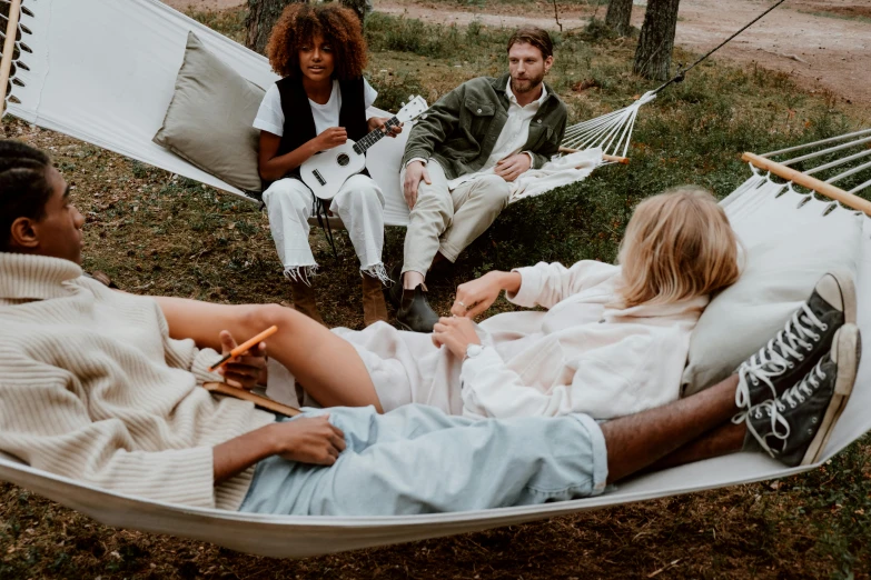 a group of people sitting in a hammock, trending on pexels, dirty linen robes, casual modern clothing, thumbnail