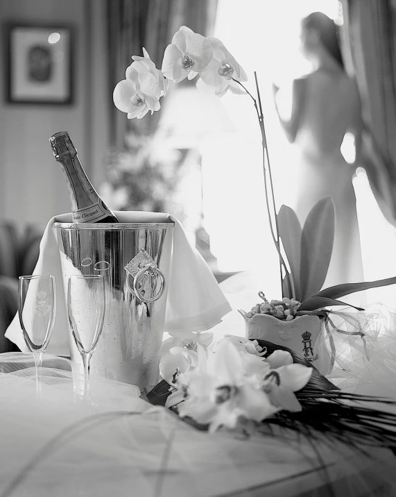 a bottle of champagne sitting on top of a table, orchids, b&w photography, thumbnail, morning hour