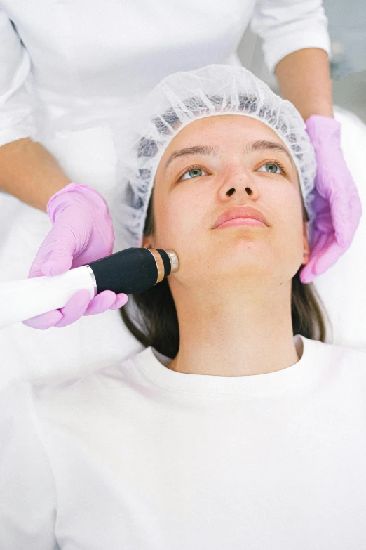 a woman getting a laser treatment in a beauty salon, by Adam Marczyński, shutterstock, happening, trypophobia acne face, thumbnail, square jaw-line, on white