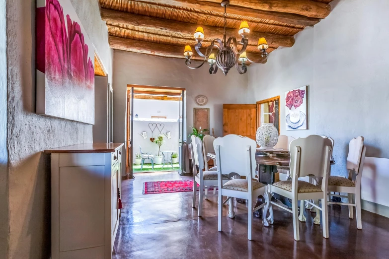 a dining room with a table and chairs, pexels contest winner, new mexico, inside house in village, ibiza, romantic themed