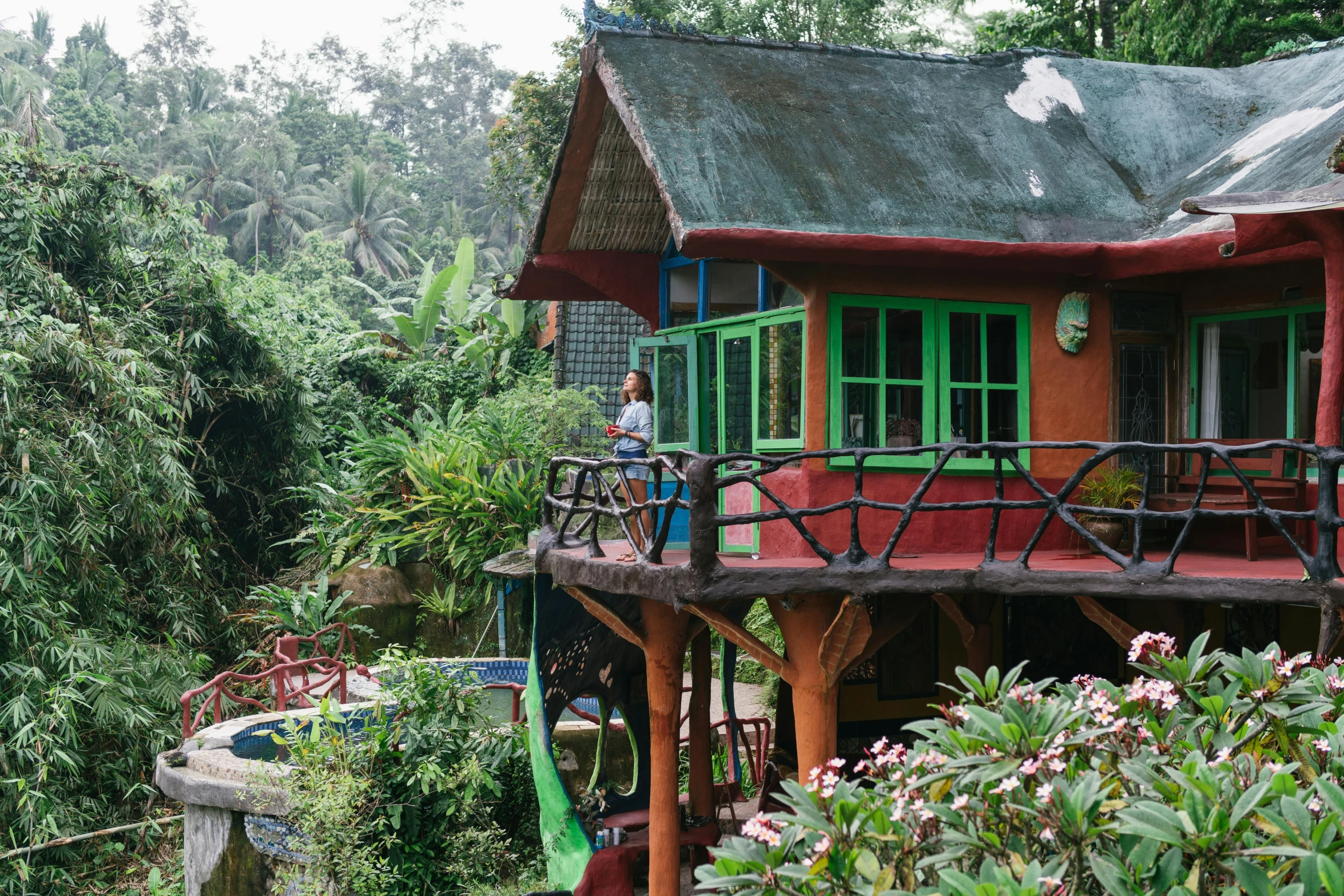 a house sitting in the middle of a lush green forest, sumatraism, colorful building, beachwood treehouse, coloured, thumbnail