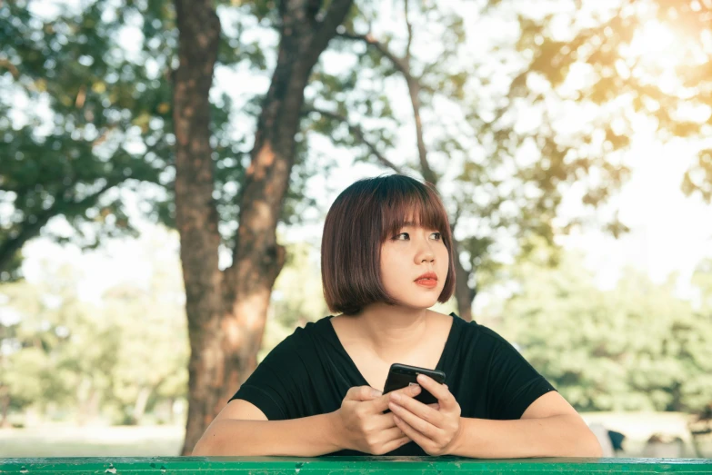 a woman sitting on a bench looking at her cell phone, unsplash, realism, anime thai girl, square, with a bob cut, 15081959 21121991 01012000 4k