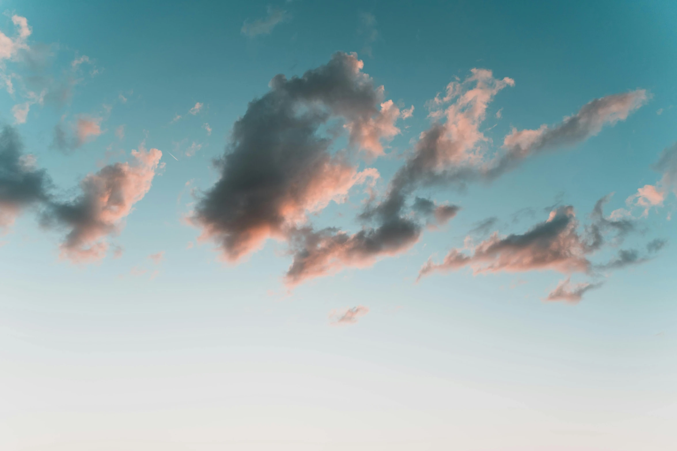 a man flying a kite on top of a lush green field, inspired by Elsa Bleda, unsplash, aestheticism, light pink clouds, cumulus clouds, nature photo, muted colors with minimalism