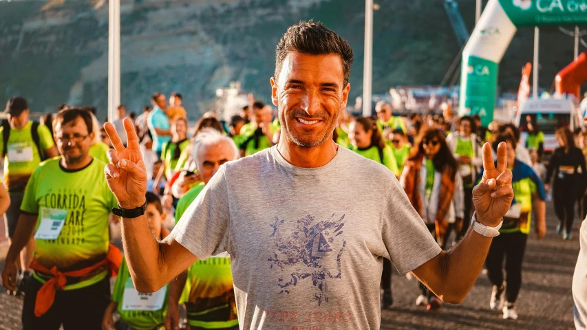 a man standing in front of a crowd of people, by Giuseppe Avanzi, pexels contest winner, smiling spartan, pablo hurtado de mendoza, ironman, avatar image