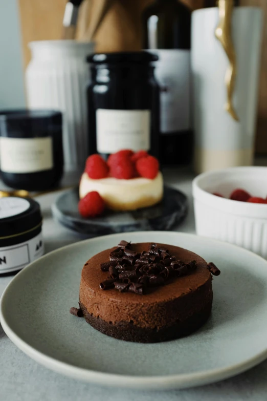 a chocolate cake sitting on top of a white plate, a still life, inspired by Richmond Barthé, unsplash, romanticism, 王琛, celebration of coffee products, 84mm), creamy skin