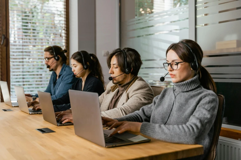 a group of people sitting at a table with laptops, trending on pexels, hurufiyya, wearing headset, royal commission, thumbnail, maintenance