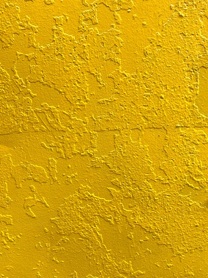 a close up of a yellow painted wall, flickr, intense subsurface scattering, detailed product image, textured 3 d, color”