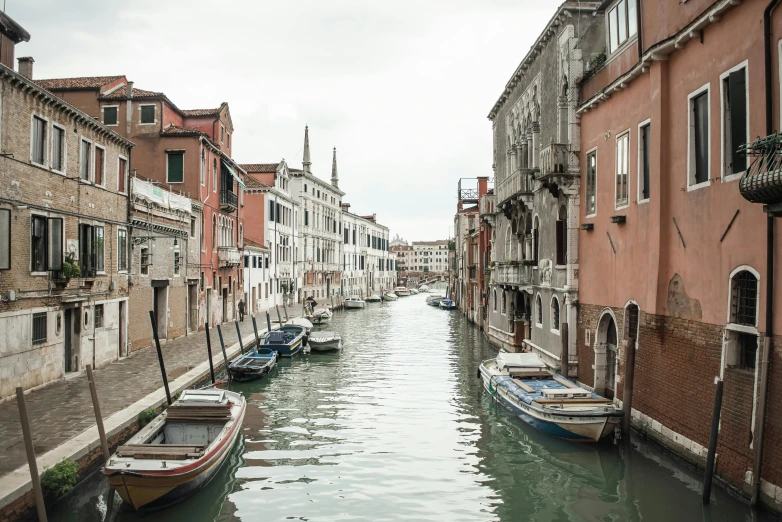 a canal filled with lots of boats next to tall buildings, inspired by Quirizio di Giovanni da Murano, pexels contest winner, whitewashed buildings, grain”, fine art print, a quaint