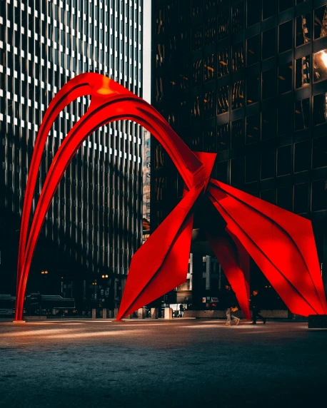a red sculpture in the middle of a city, pexels contest winner, modern chicago streets, pointed arches, a dark phoenix, public art