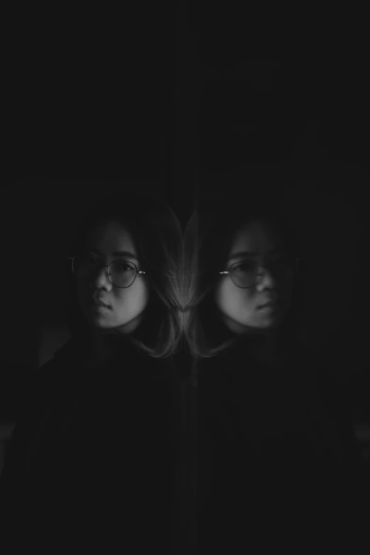 two people standing next to each other in the dark, a black and white photo, inspired by Jung Park, unsplash, girl with glasses, mirrored, image split in half, mingchen shen