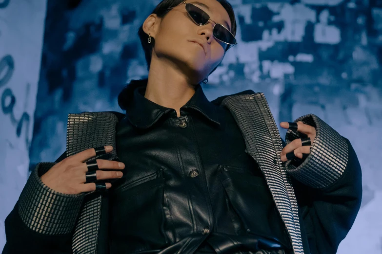 a close up of a person wearing a jacket and sunglasses, trending on pexels, bauhaus, hong june hyung, leather jewelry, performing a music video, jean paul gaultier