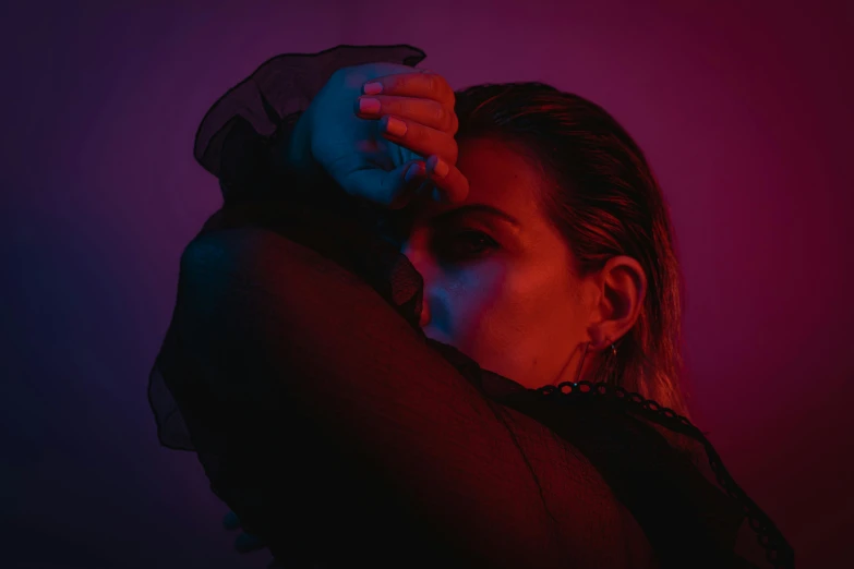 a woman with her hands on her head, an album cover, inspired by Elsa Bleda, trending on pexels, realism, neon operator margot robbie, side profile waist up portrait, dim red light, portrait of florence pugh