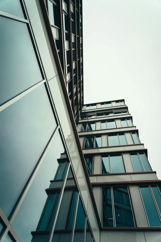 a very tall building with lots of windows, by Sebastian Spreng, unsplash, modernism, view from the side”, architectural finishes, view from ground, high quality upload