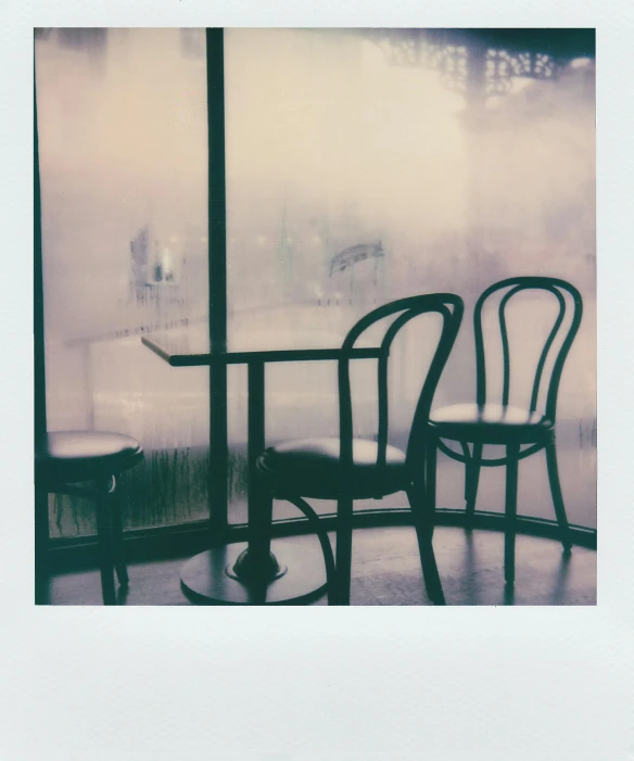 two chairs and a table in front of a window, a polaroid photo, unsplash, isolate translucent, cafe, photograph”