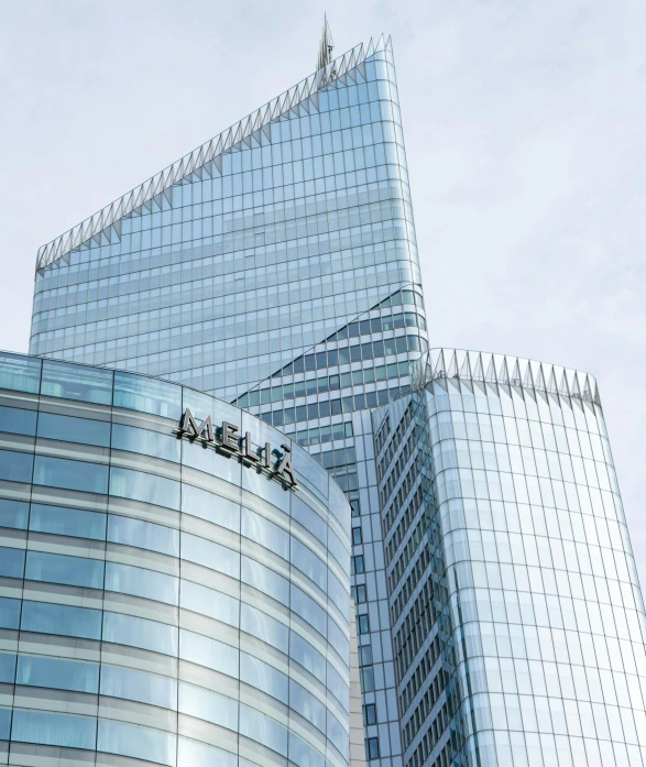 a group of tall buildings sitting next to each other, an album cover, by Micha Klein, pexels contest winner, mobius, full of clear glass facades, exterior view, mcdonald