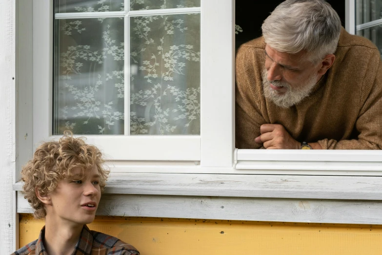 a man and a boy looking out of a window, sophia lillis, he has a beard and graying hair, two skinny old people, ignant