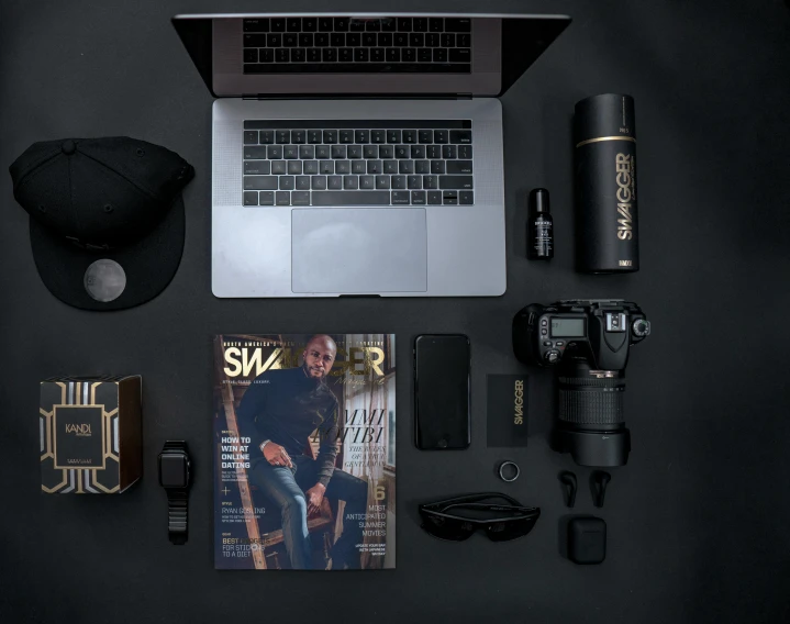 a laptop computer sitting on top of a black table, by Sam Black, swagger, various items, instagram picture, studio photoshot