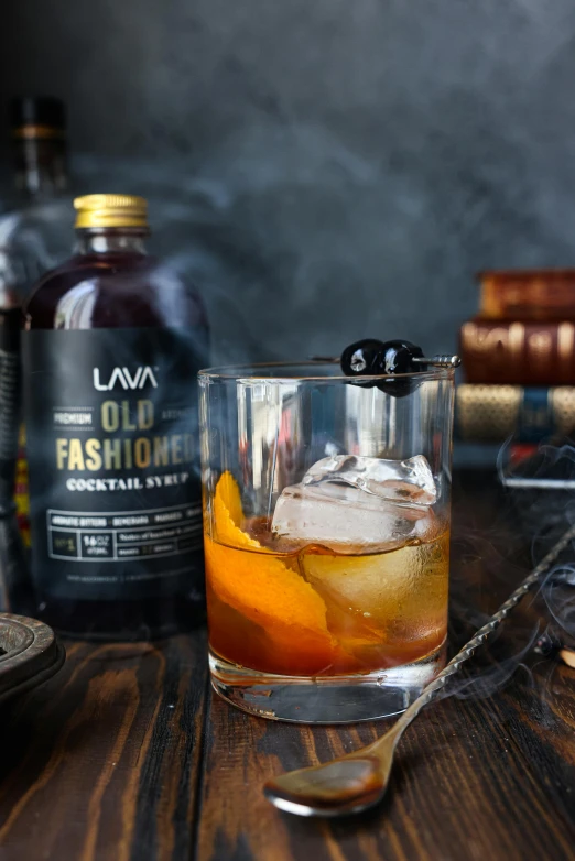 a glass filled with a drink sitting on top of a wooden table, inspired by Viktor Oliva, unsplash, baroque, old fashioned, full dress of lava showcase, & a dark, on a gray background