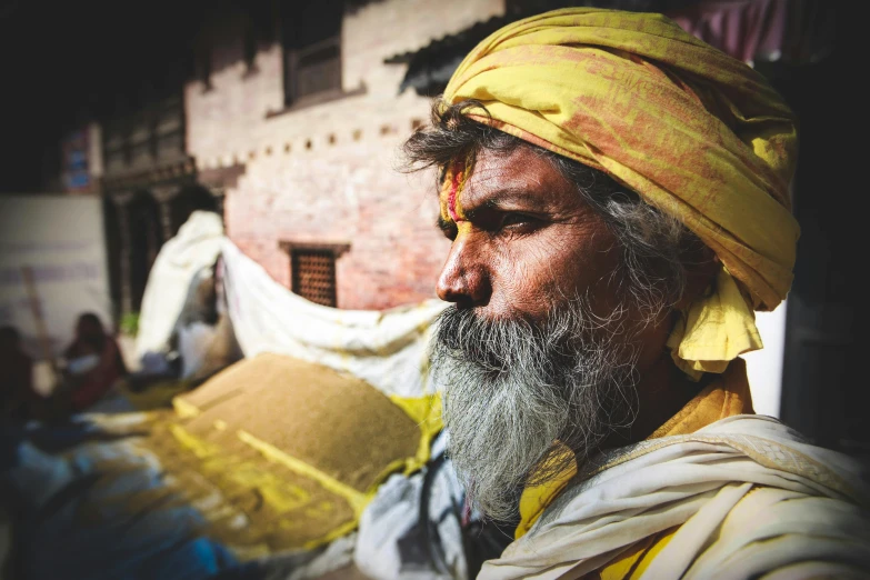 a man with a long beard wearing a yellow turban, pexels contest winner, nepal, avatar image, archeological discover, flowing hair and long robes