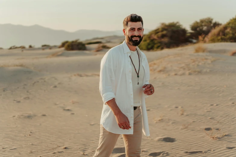 a man standing on top of a sandy beach, neat beard, avatar image, professional image, fan favorite