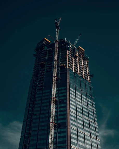 a tall building under construction on a cloudy day, pexels contest winner, on a dark background, thumbnail, multiple stories, portait photo