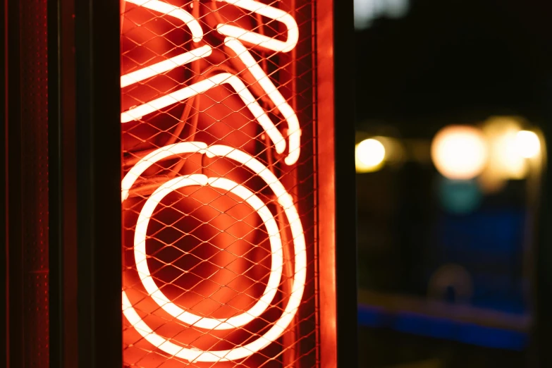 a close up of a neon sign on a pole, bicycle, miko, reddish exterior lighting, rokoko