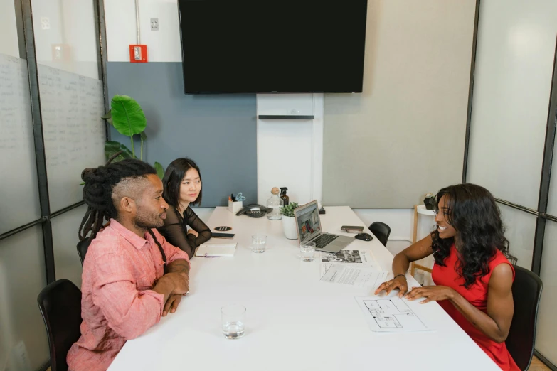 a group of people sitting around a white table, a picture, profile image, mkbhd, sydney park, ready for a meeting