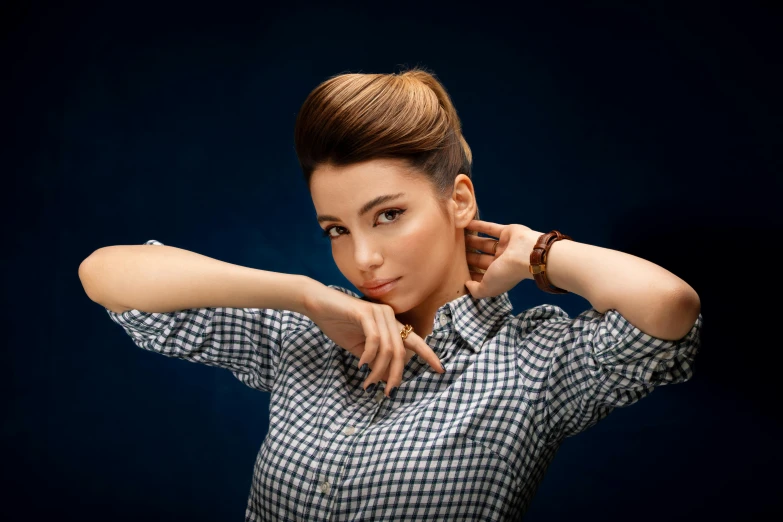 a woman in a checkered shirt poses for a picture, by Adam Marczyński, trending on pixabay, hurufiyya, playful updo, blue jewellery, 15081959 21121991 01012000 4k, brown neat hair