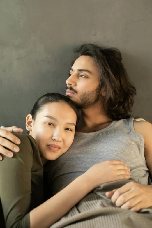 a man and woman laying in bed next to each other, trending on pexels, renaissance, half asian, two men hugging, thoughtful, mid long hair