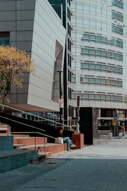 a man riding a skateboard down a sidewalk, inspired by Ned M. Seidler, pexels contest winner, modernism, overwatch building, sitting, downtown mexico, panoramic anamorphic