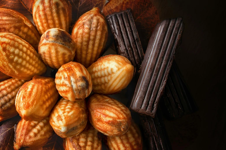 a bunch of cookies sitting on top of a table, a still life, inspired by Charles Le Roux, shutterstock contest winner, fuji choco, shells, high angle close up shot, a pair of ribbed
