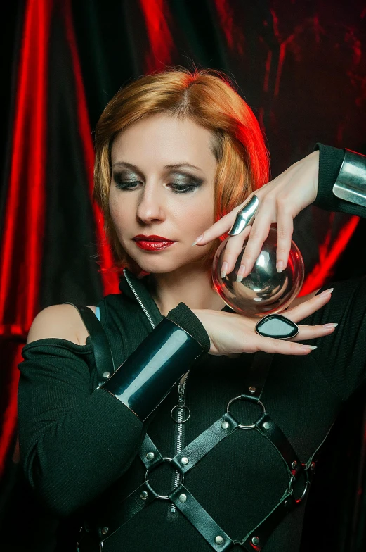 a woman in a black outfit holding a wine glass, inspired by hajime sorayama, retrofuturism, leather cuffs around wrists, a woman holding an orb, triss merigold cosplay, dj sura