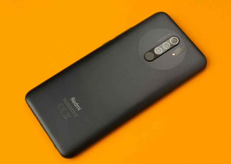 the back of a black nokia phone on an orange background, pexels contest winner, realism, square, a tall, ƒ/5.6, reboot