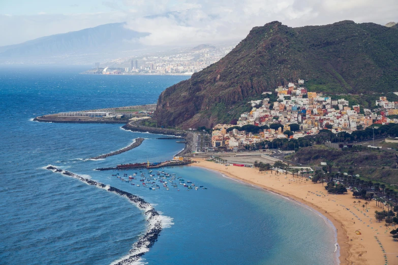 a large body of water next to a beach, by Daniel Lieske, pexels contest winner, renaissance, fishing town, “ aerial view of a mountain, spanish, 2 5 6 x 2 5 6 pixels