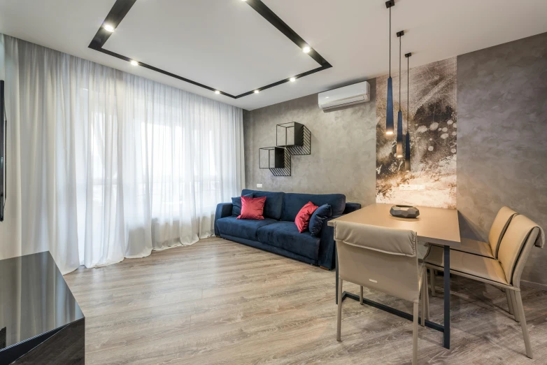 a living room filled with furniture and a flat screen tv, by Adam Marczyński, light and space, soft grey and red natural light, blue accents, popular interior design style, office ceiling panels