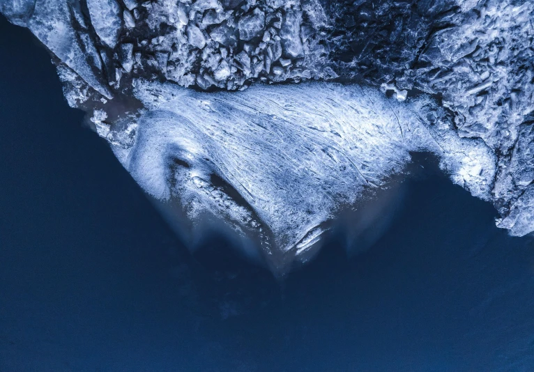 a bird's eye view of a body of water, an album cover, unsplash contest winner, an ice volcano, blue whale, close - up portrait shot, 4k —height 1024 —width 1024