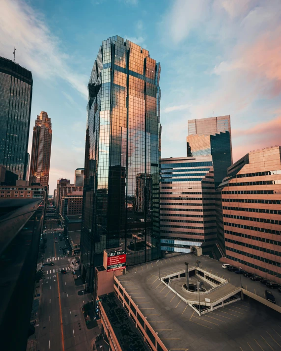 a very tall building sitting in the middle of a city, minneapolis, unsplash photo contest winner, 2 0 2 2 photo, filtered evening light