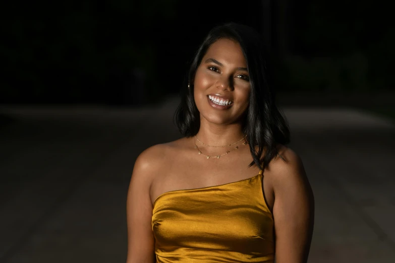 a woman in a yellow dress posing for a picture, light brown skin, low lighting, nivanh chanthara, formal portrait